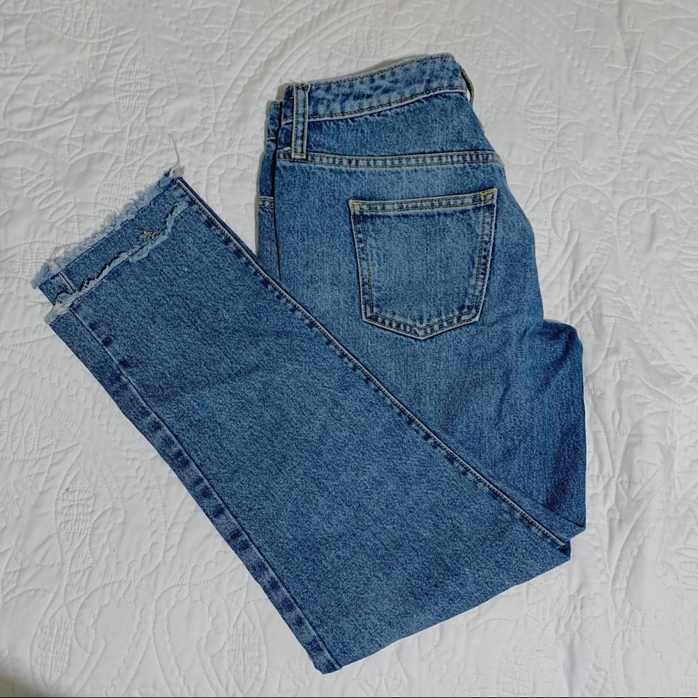 Mid rise medium washed frayed bottom mom jeans